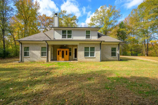 front view of a house with a yard