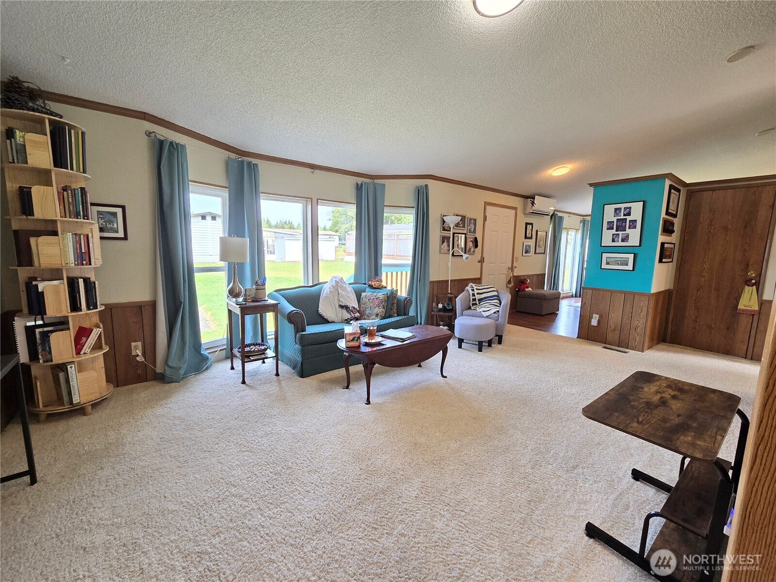 57 Clemons Road, Unit 12 Montesano, WA 98563 - Photo 13 of 30 a living room with furniture and a flat screen tv