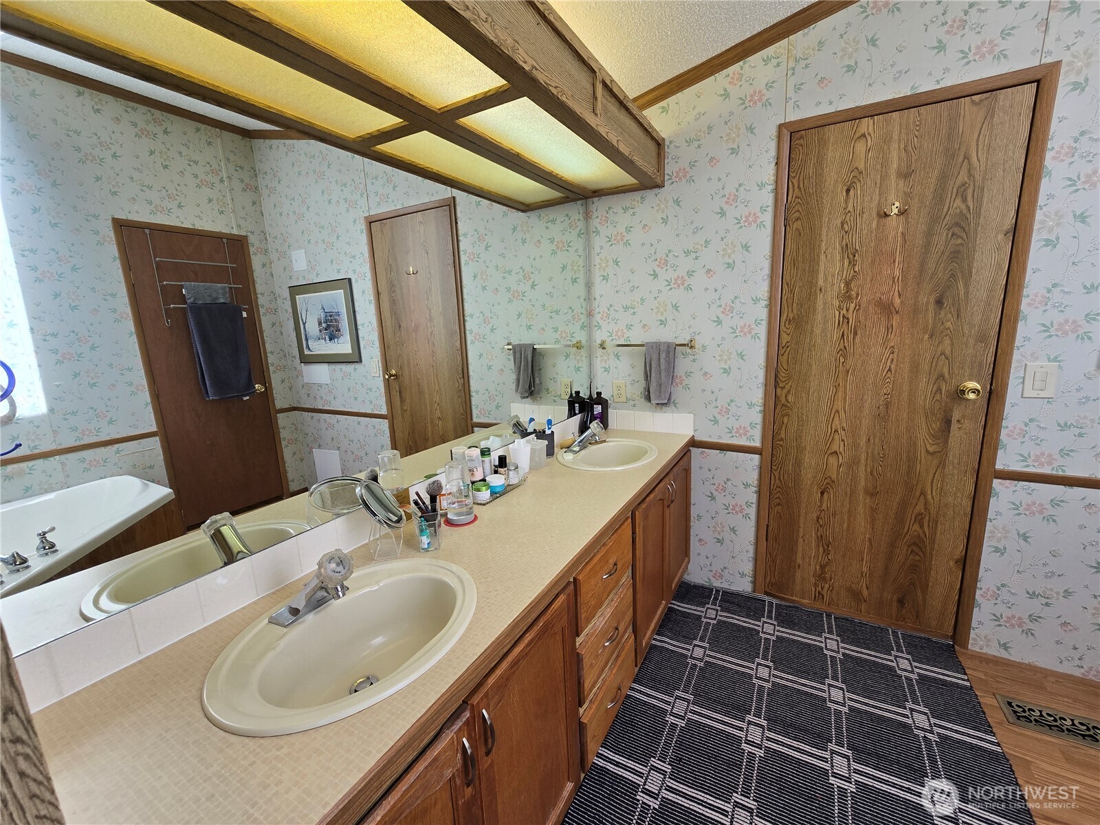 57 Clemons Road, Unit 12 Montesano, WA 98563 - Photo 18 of 30 a bathroom with a sink a toilet and mirror