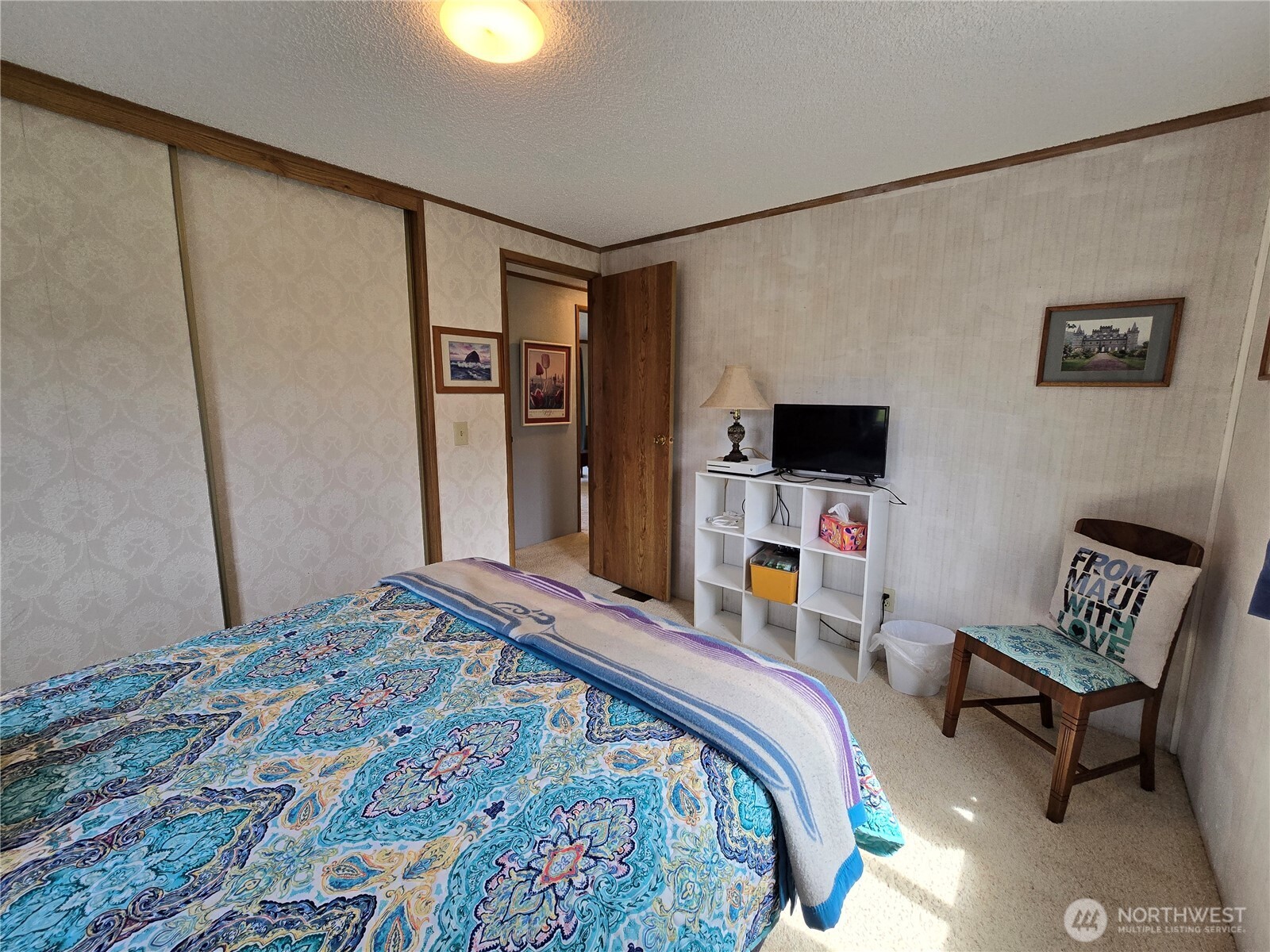 57 Clemons Road, Unit 12 Montesano, WA 98563 - Photo 22 of 30 a bedroom with a bed and wooden floor