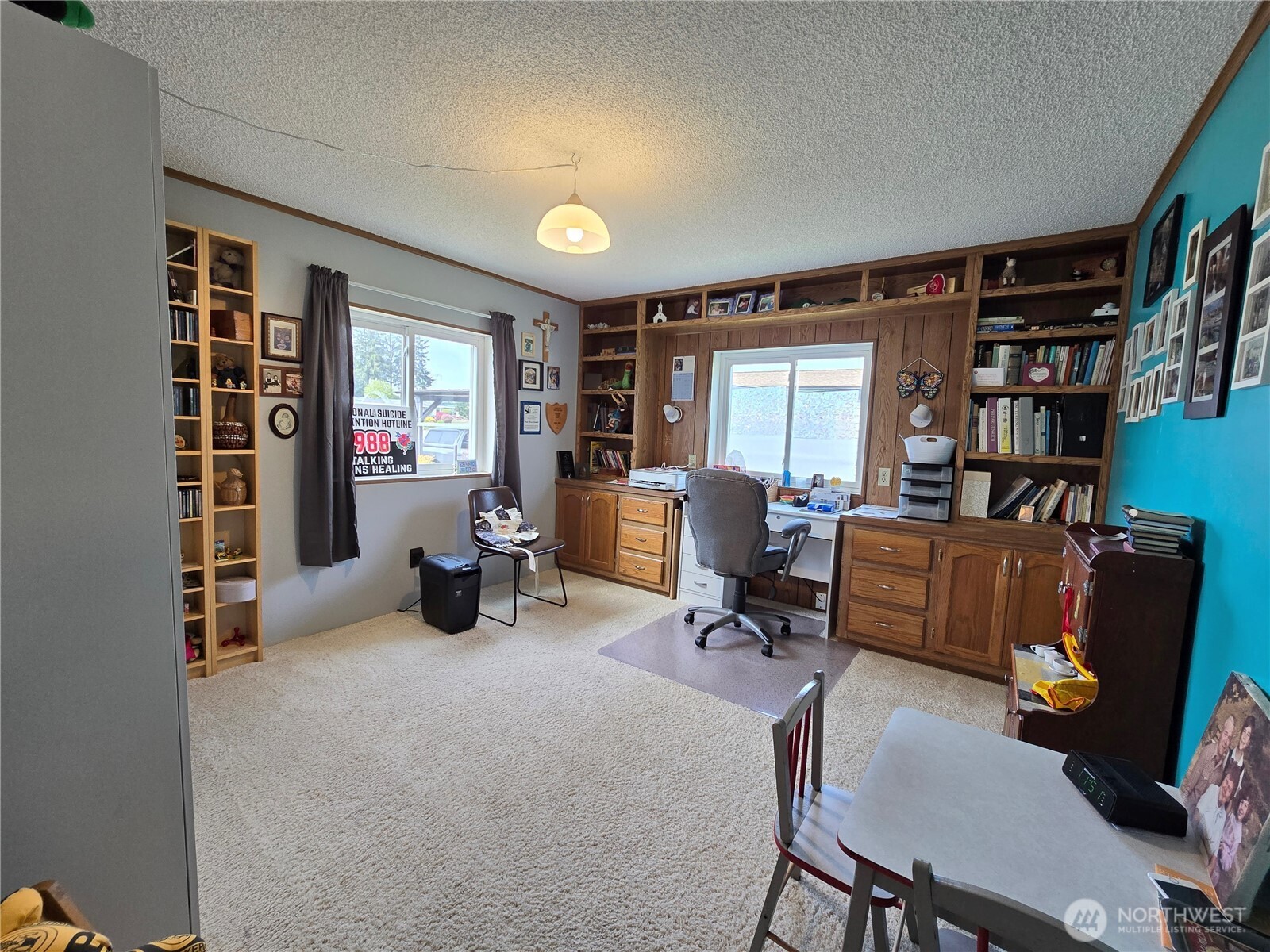57 Clemons Road, Unit 12 Montesano, WA 98563 - Photo 23 of 30 a work room with furniture and a bookshelf