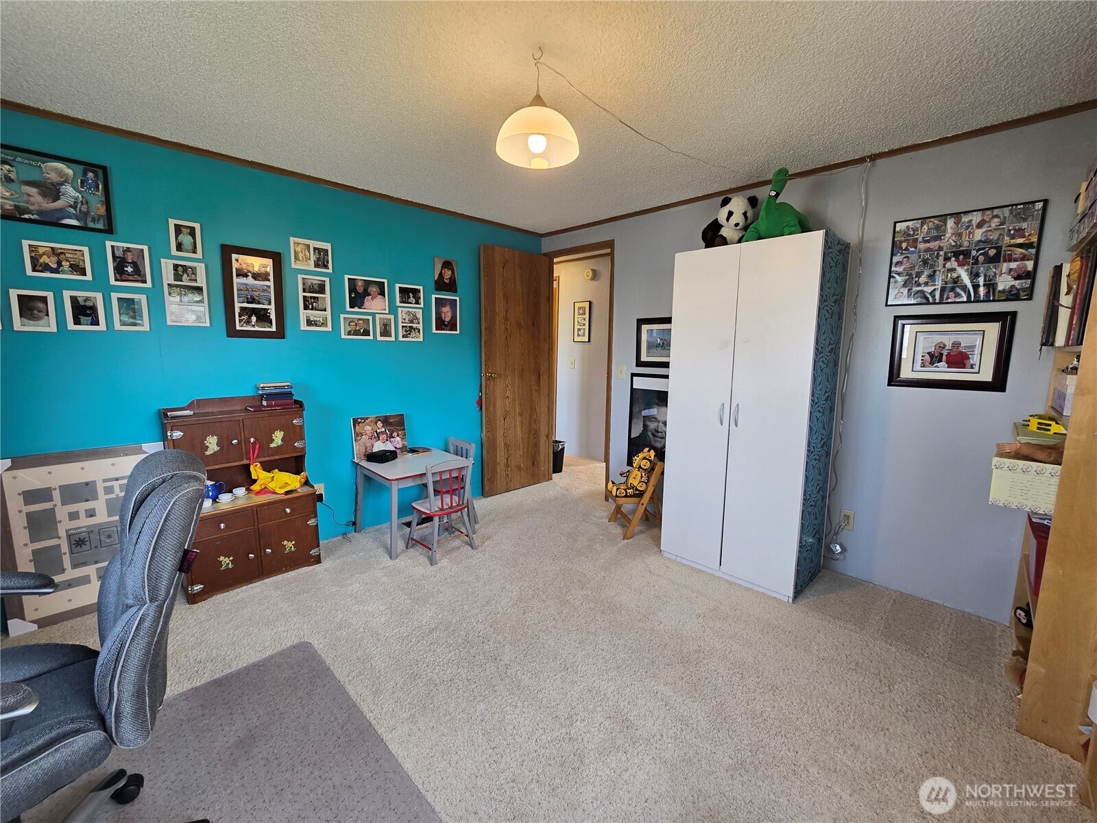57 Clemons Road, Unit 12 Montesano, WA 98563 - Photo 24 of 30 a room with furniture and a lamp