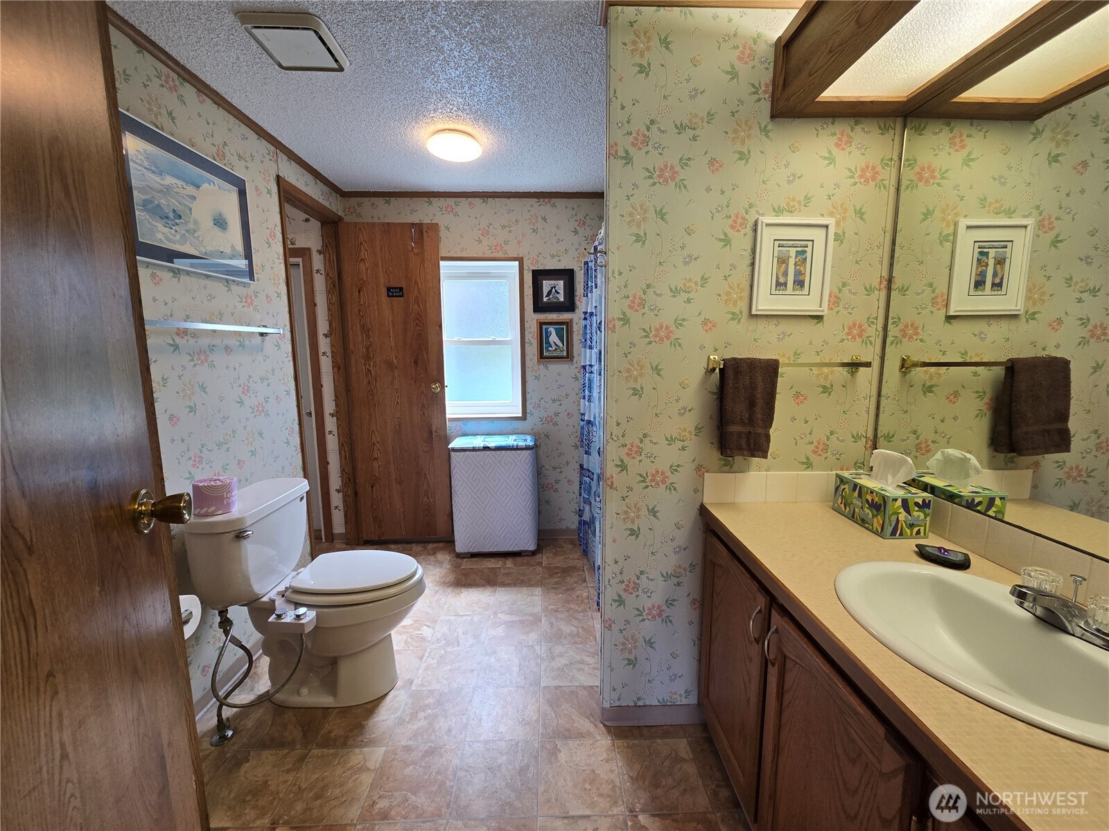 57 Clemons Road, Unit 12 Montesano, WA 98563 - Photo 25 of 30 a bathroom with a sink toilet and shower