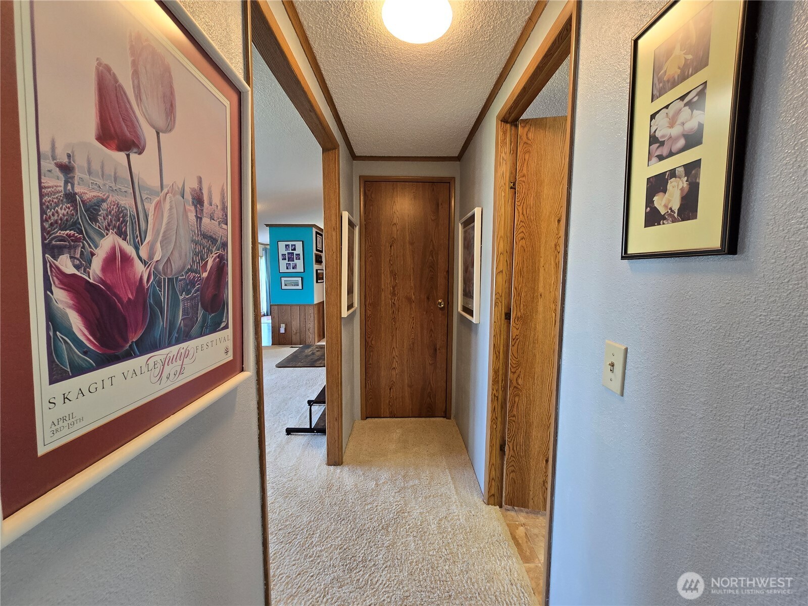 57 Clemons Road, Unit 12 Montesano, WA 98563 - Photo 27 of 30 a view of a hallway with wooden floor and windows