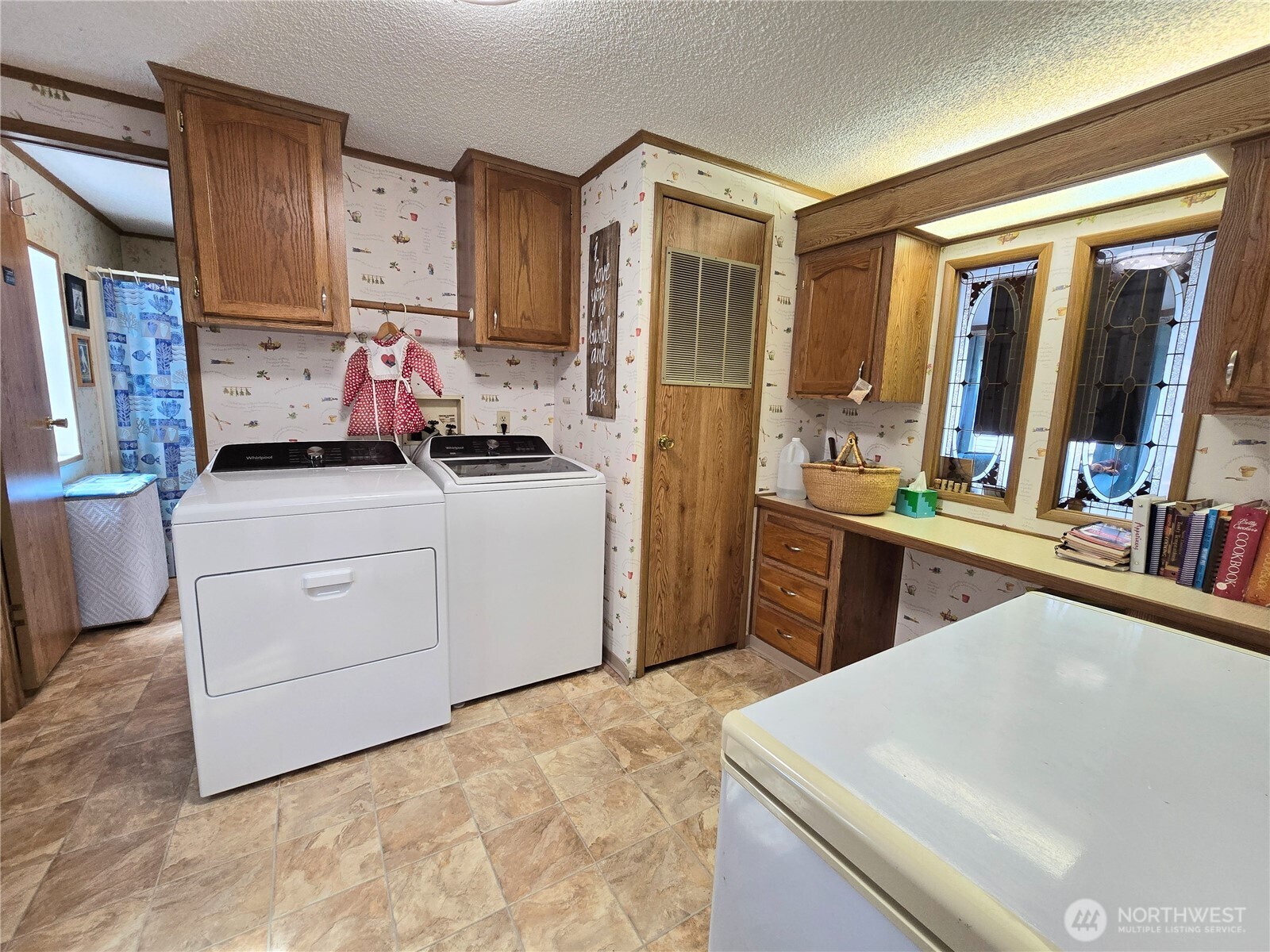 57 Clemons Road, Unit 12 Montesano, WA 98563 - Photo 28 of 30 a kitchen with a sink stove and cabinets