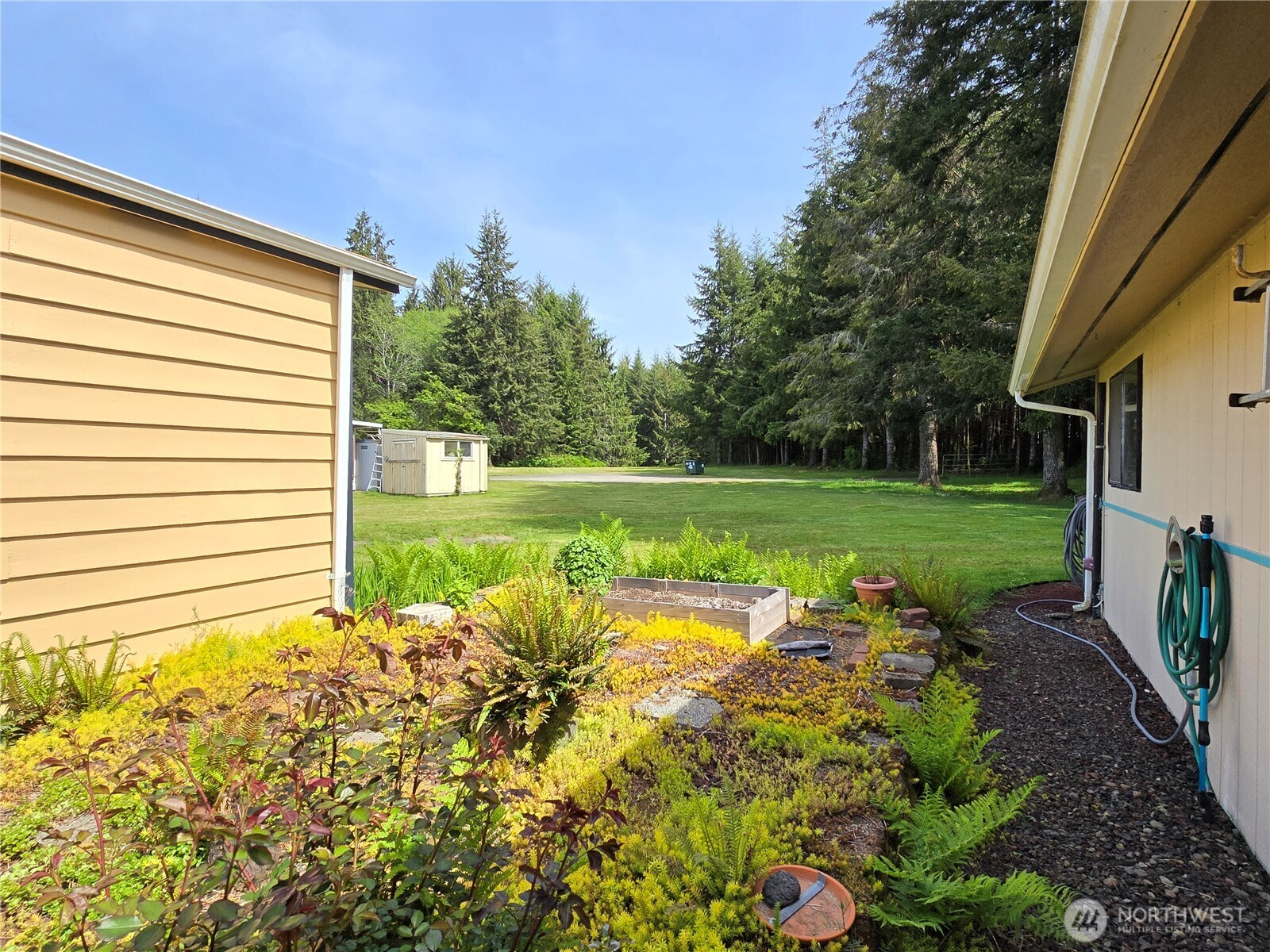 57 Clemons Road, Unit 12 Montesano, WA 98563 - Photo 3 of 30 a view of a garden with an outdoor space