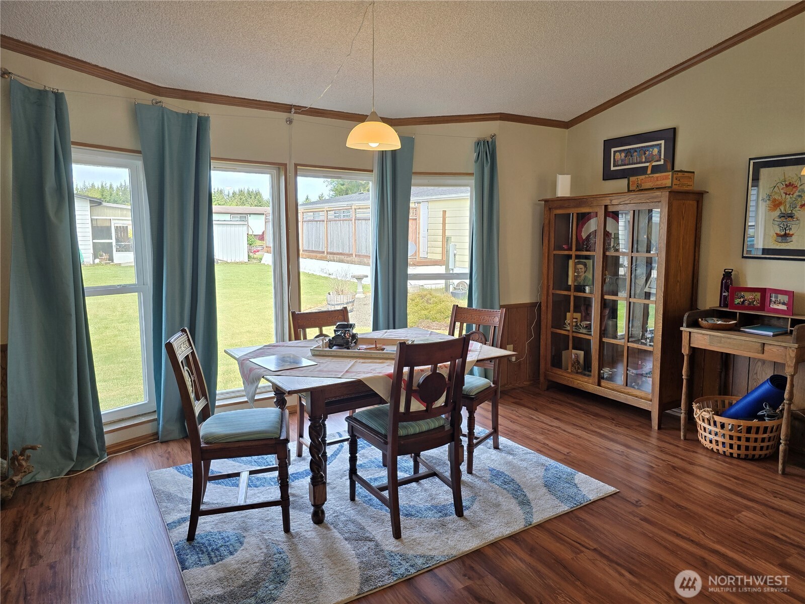 57 Clemons Road, Unit 12 Montesano, WA 98563 - Photo 10 of 30 a view of a dining room with furniture and wooden floor