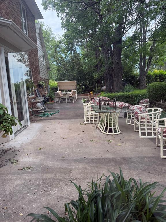 83 Bass Road Pottsboro, TX 75076 - Photo 21 of 31 Expansive concrete patio area offering direct access to the interior via double French doors