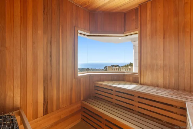 a view of a balcony with chair and door
