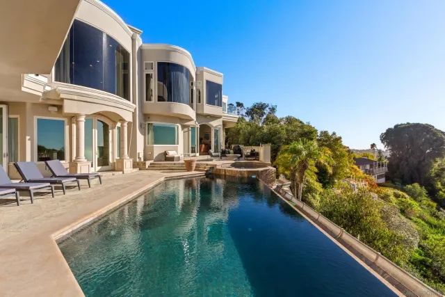 a view of a swimming pool with outdoor seating