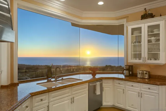 a view of a sink and a window