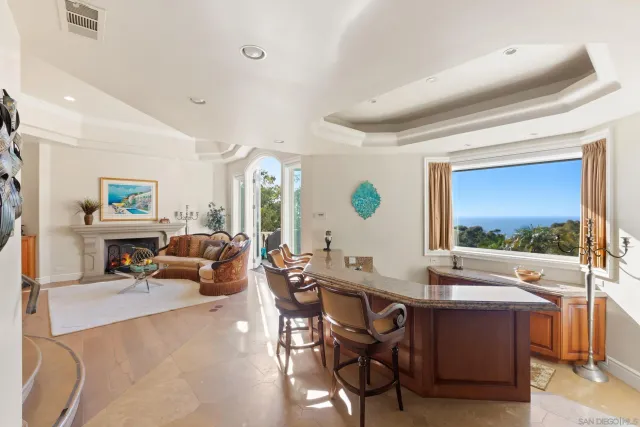 a living room with furniture a flat screen tv and a large window