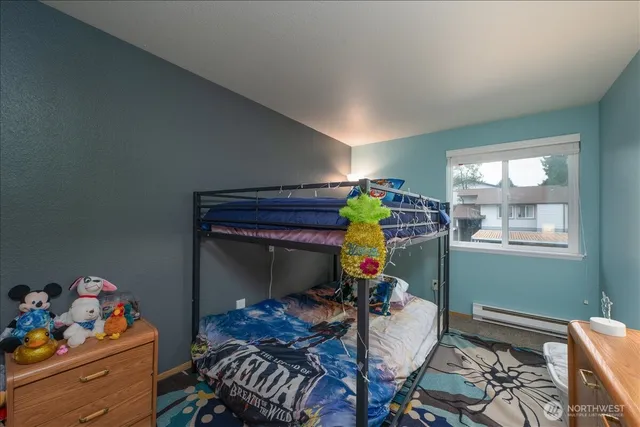 a bed room with furniture and a window