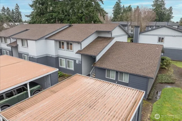 a view of a house with pool and a yard