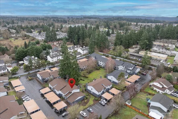 an aerial view of residential houses with outdoor space