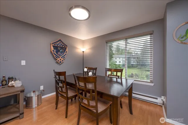 a view of a dining room with furniture window and outside view