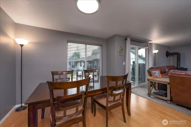 a dining room with furniture and window