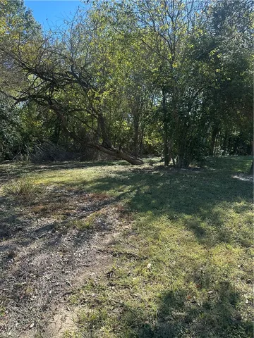 a view of a water fountain and a yard