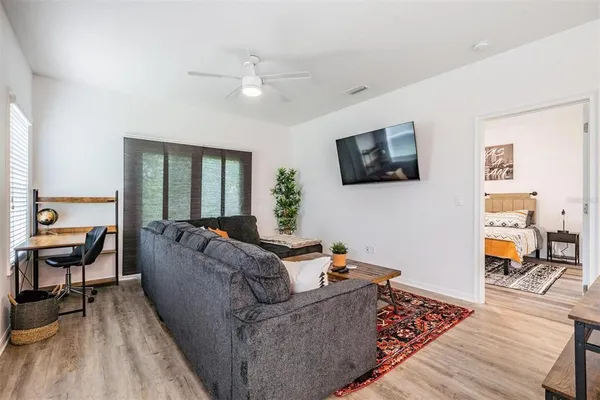 a kitchen with stainless steel appliances granite countertop a sink refrigerator and microwave