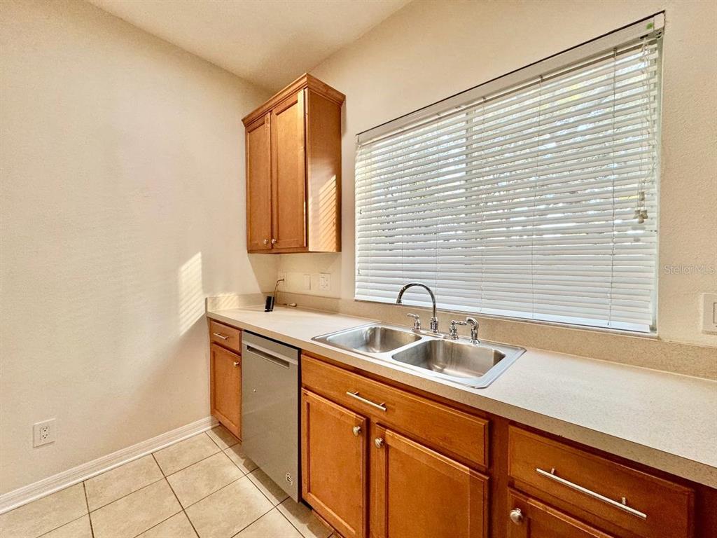 10545 Shady Falls Court Riverview, FL 33578 - Photo 12 of 36 a kitchen with a sink and cabinets