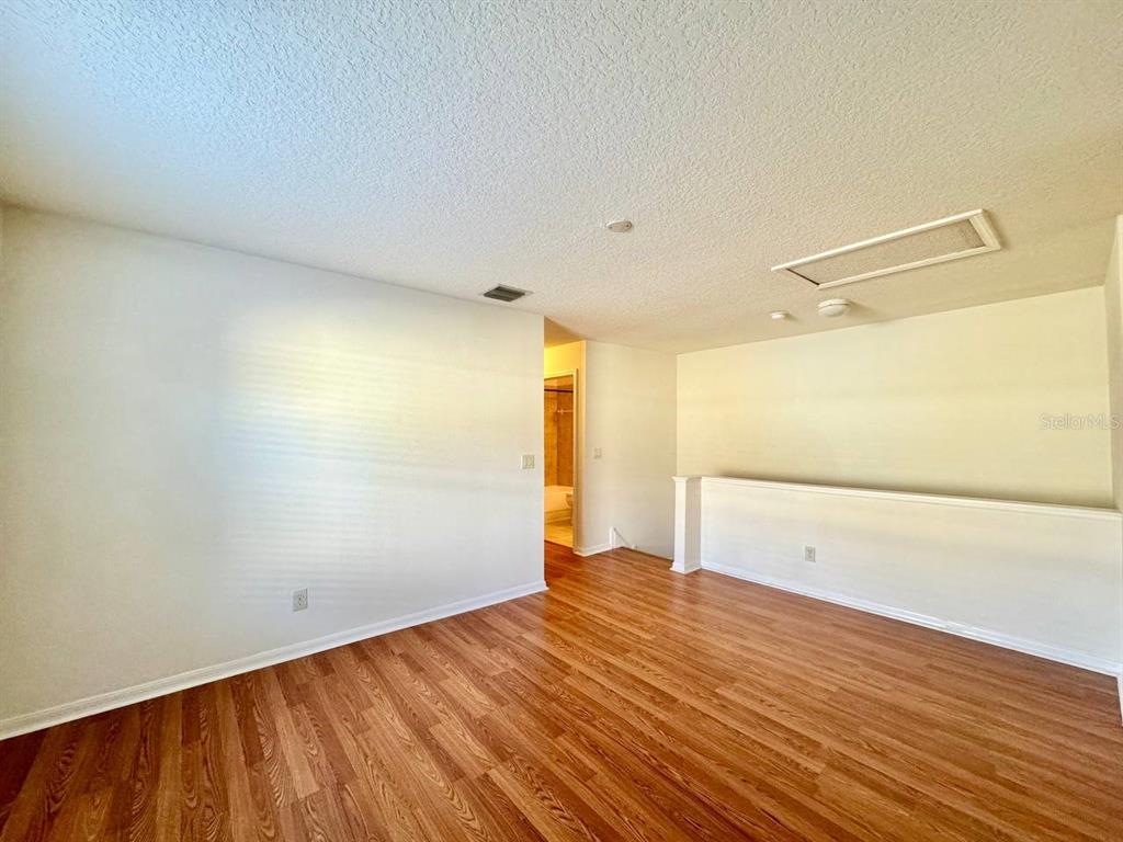 10545 Shady Falls Court Riverview, FL 33578 - Photo 15 of 36 a view of empty room with wooden floor