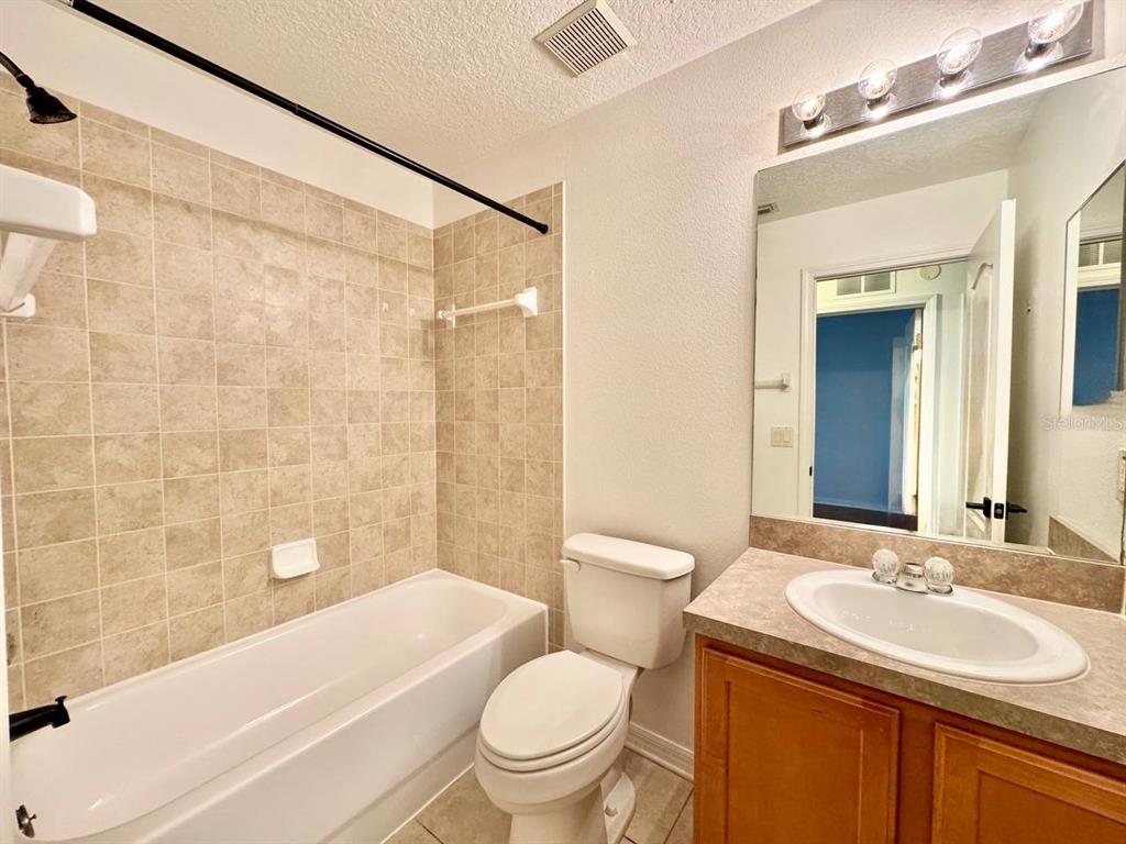 10545 Shady Falls Court Riverview, FL 33578 - Photo 20 of 36 a bathroom with a sink toilet and shower