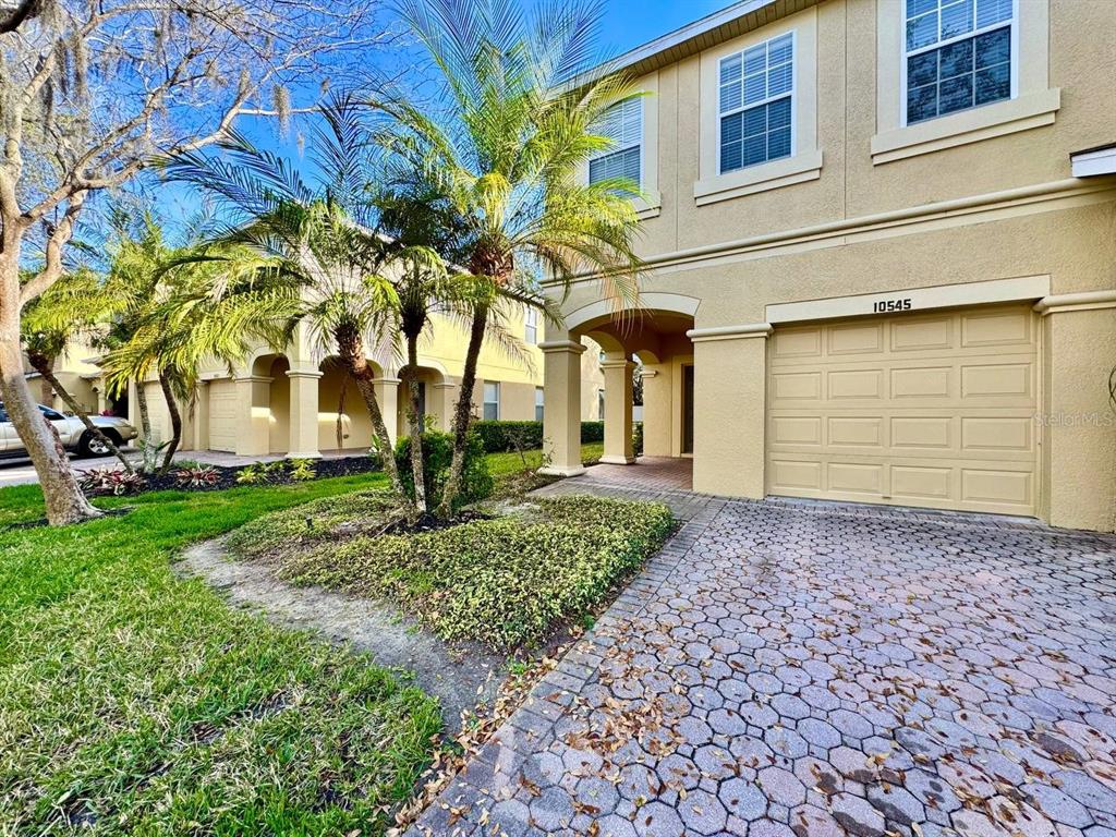 10545 Shady Falls Court Riverview, FL 33578 - Photo 2 of 36 a front view of a house with garden