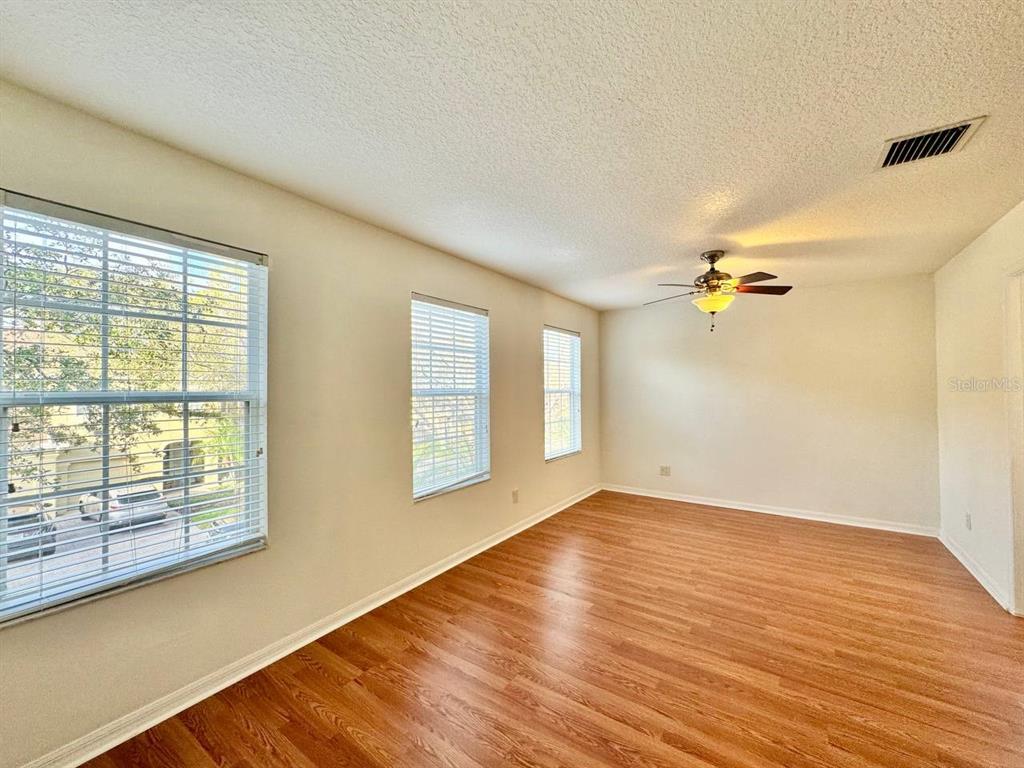 10545 Shady Falls Court Riverview, FL 33578 - Photo 24 of 36 wooden floor in an empty room with a window