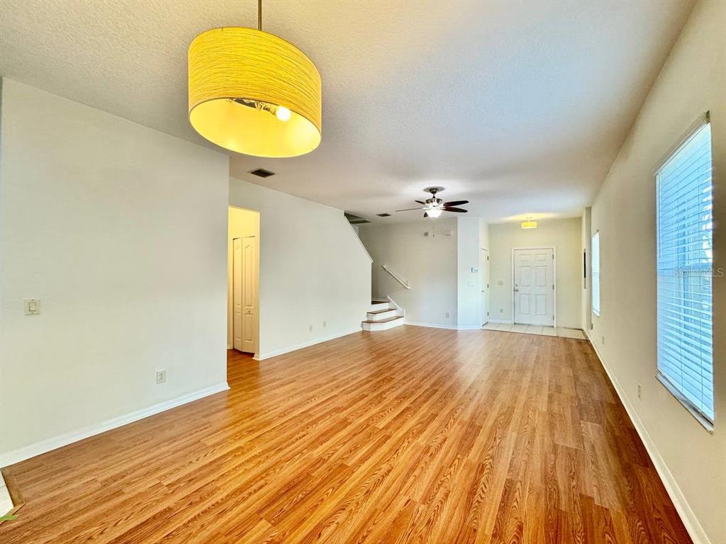 10545 Shady Falls Court Riverview, FL 33578 - Photo 6 of 36 wooden floor in an empty room with a window