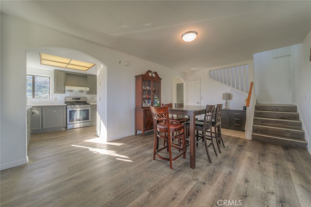 51201 Deer Mountain Way Anza, CA 92539 - Photo 15 of 65 a view of a dining room with furniture window and wooden floor