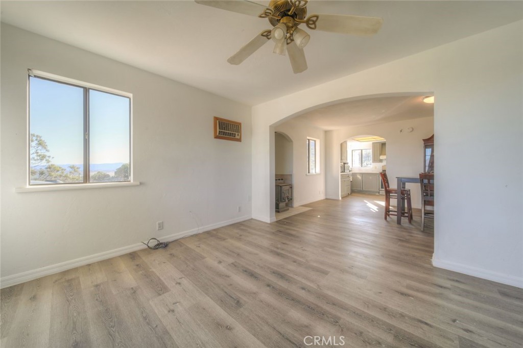 51201 Deer Mountain Way Anza, CA 92539 - Photo 19 of 65 a view of an empty room with wooden floor and a window