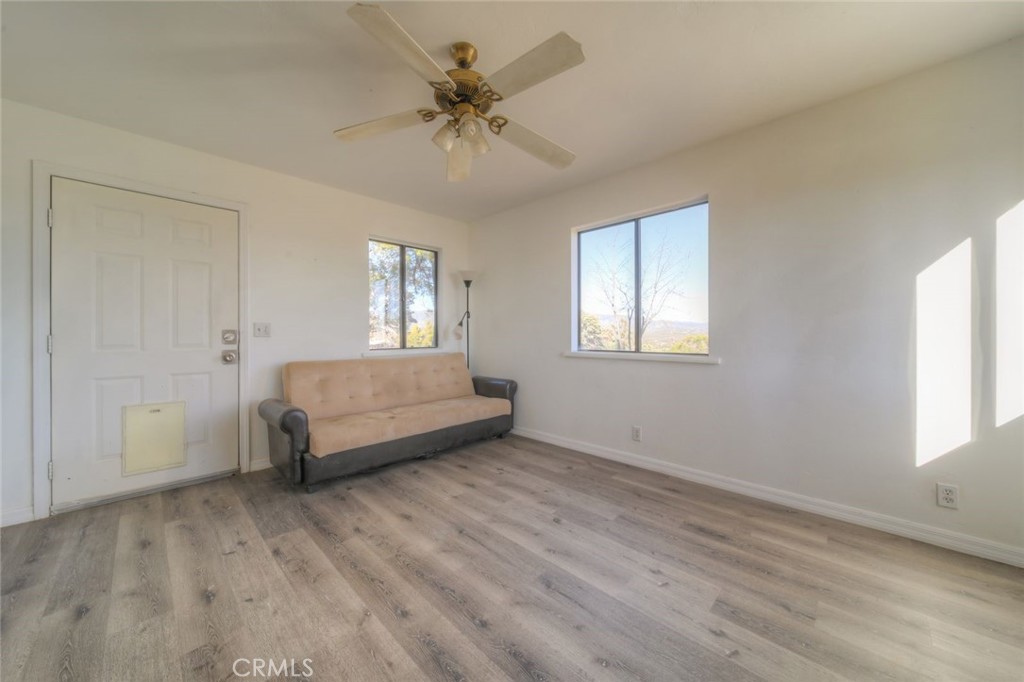 51201 Deer Mountain Way Anza, CA 92539 - Photo 28 of 65 a spacious bedroom with a bed and a window