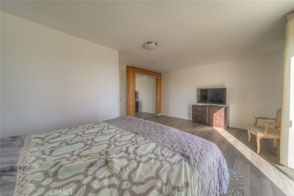 51201 Deer Mountain Way Anza, CA 92539 - Photo 33 of 65 a bedroom with a bed and a flat screen tv