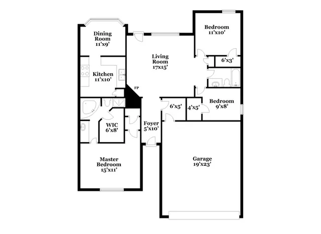 an empty room with windows and fireplace