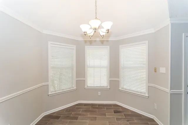 a kitchen with stainless steel appliances granite countertop a stove a sink dishwasher a microwave oven with granite countertops and cabinets