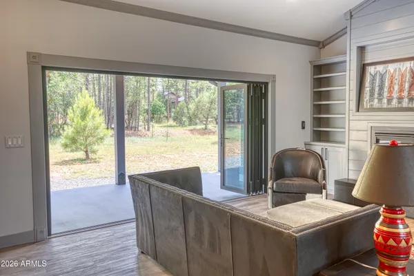 a dining room with furniture and a window