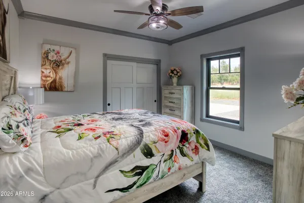 a bedroom with a bed and a window