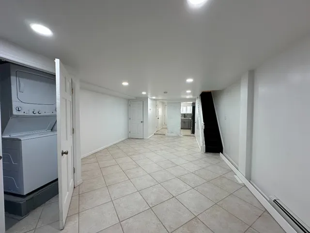 a view of a hallway with storage and utility