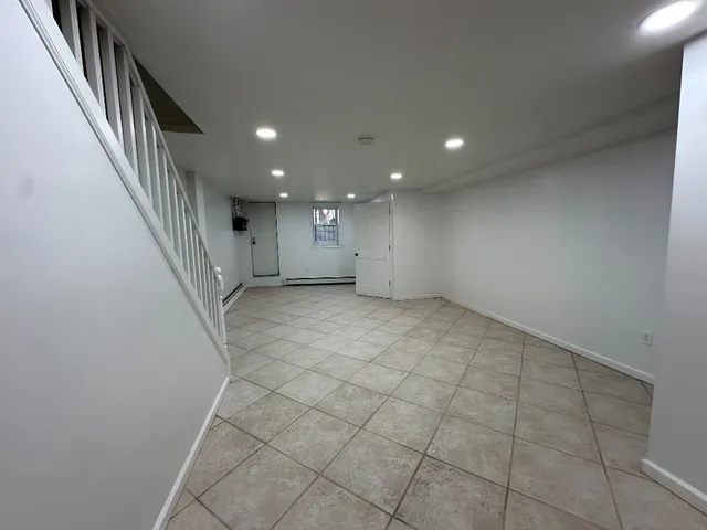 a view of an empty room with stairs
