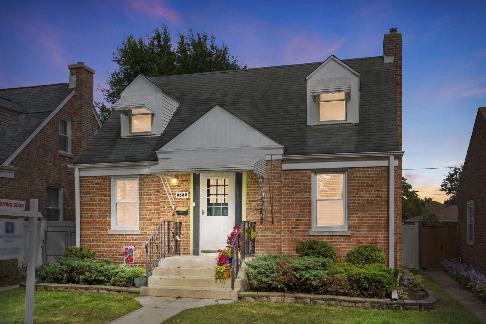 a front view of a house with a yard