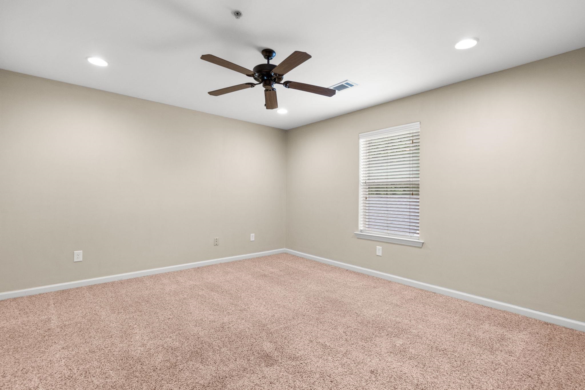 2275 McVay Road, Unit 2275 Germantown, TN 38138 - Photo 21 of 40 an empty room with windows and fan