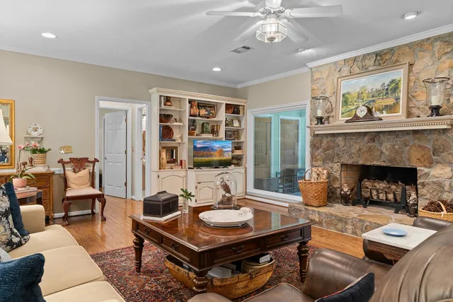 a bathroom with a granite countertop sink mirror and a bathtub