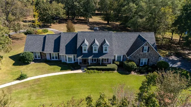 a view of swimming pool in front of house