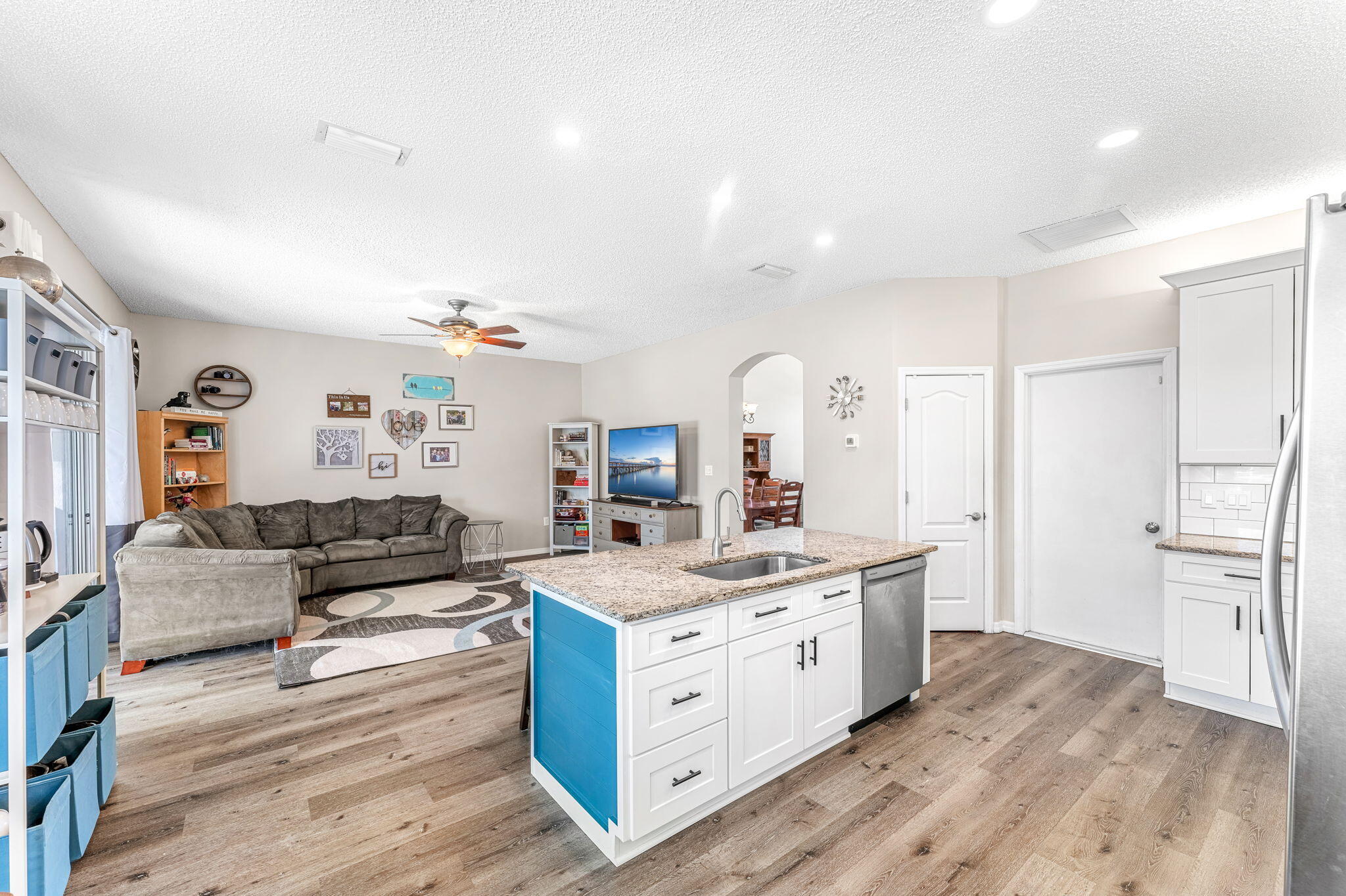 981 Shaw Circle Melbourne, FL 32940 - Photo 14 of 58 a view of kitchen with stainless steel appliances kitchen island a stove a refrigerator cabinets and living room view
