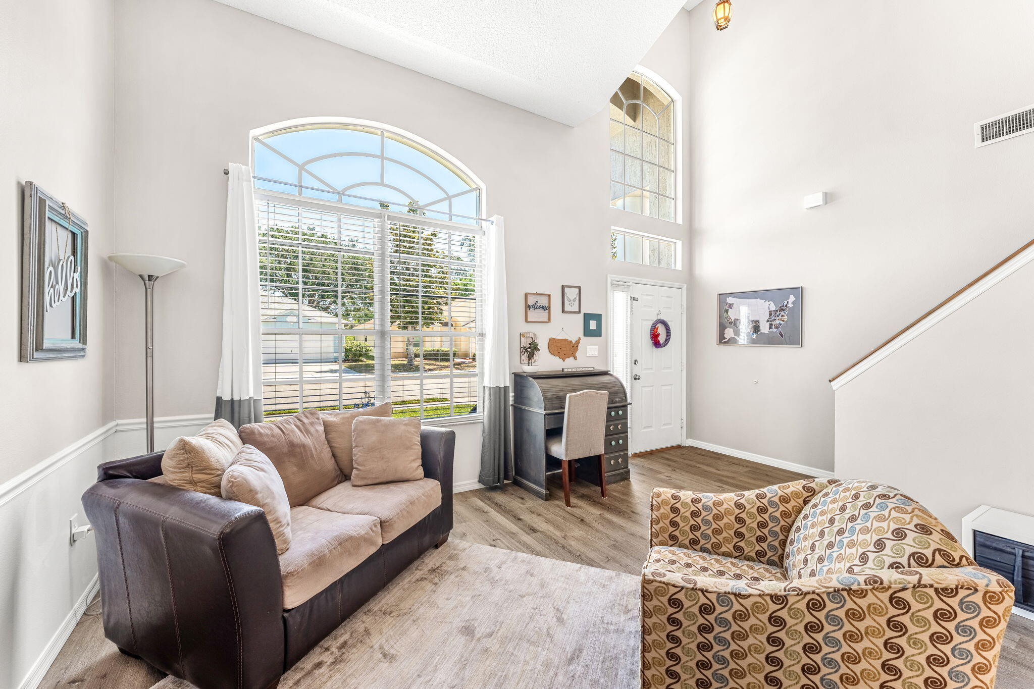 981 Shaw Circle Melbourne, FL 32940 - Photo 24 of 58 a living room with furniture and a large window