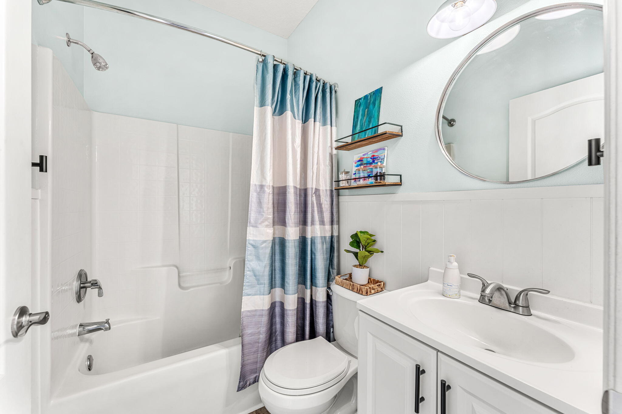 981 Shaw Circle Melbourne, FL 32940 - Photo 26 of 58 a bathroom with a sink toilet and shower