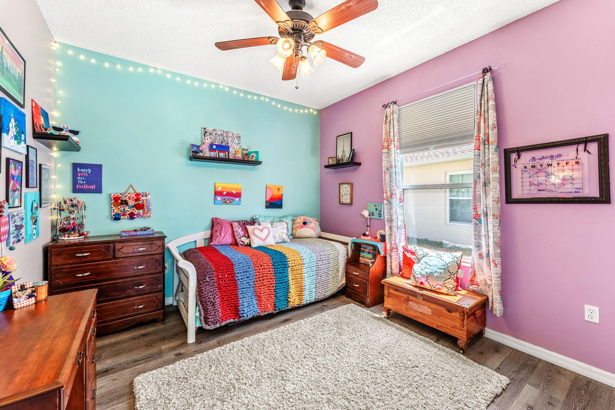 981 Shaw Circle Melbourne, FL 32940 - Photo 28 of 58 a bedroom with a bed and wooden floor