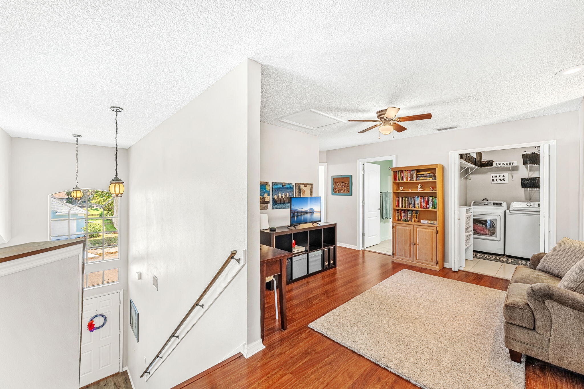 981 Shaw Circle Melbourne, FL 32940 - Photo 30 of 58 a living room with furniture and a wooden floor