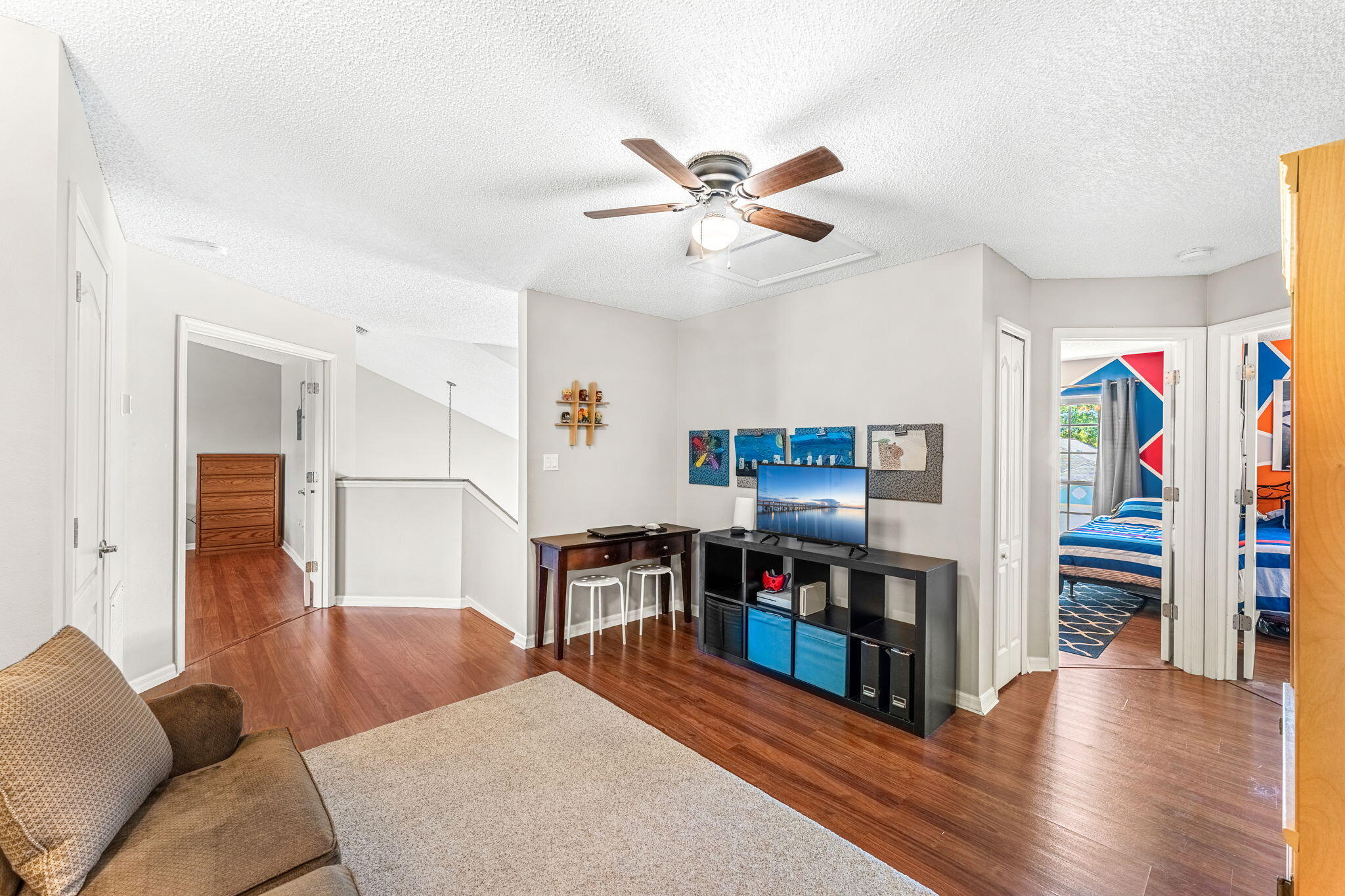 981 Shaw Circle Melbourne, FL 32940 - Photo 31 of 58 a living room with furniture and a flat screen tv