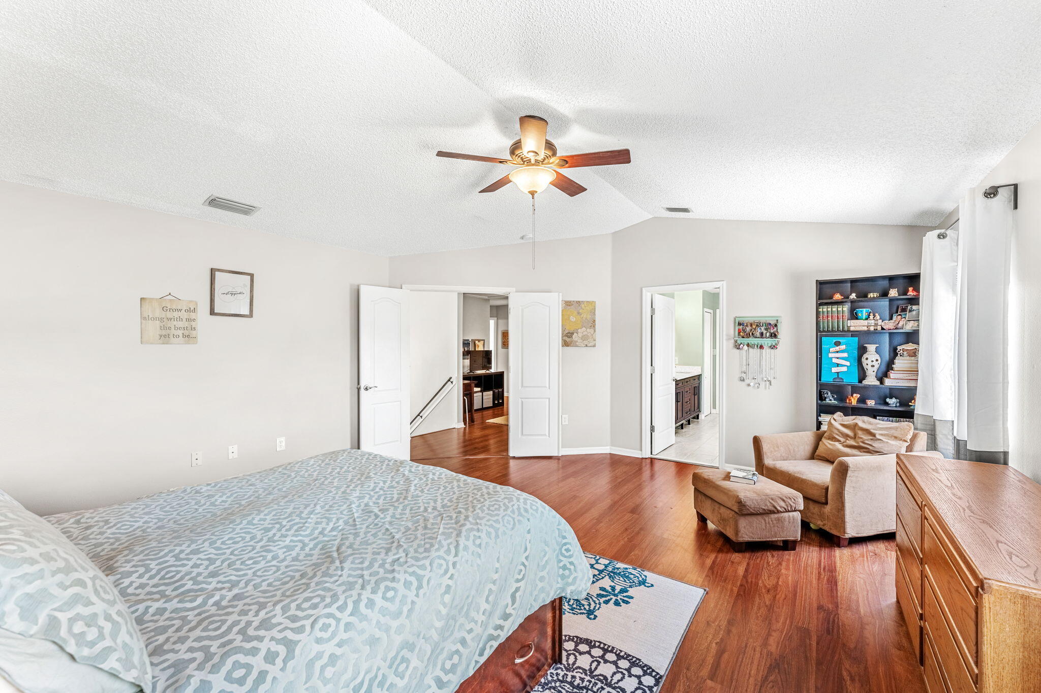 981 Shaw Circle Melbourne, FL 32940 - Photo 34 of 58 a bedroom with a bed and ceiling fan